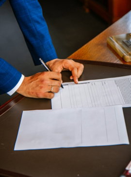 person-writing-on-white-form-paper.jpg person writing on white form paper