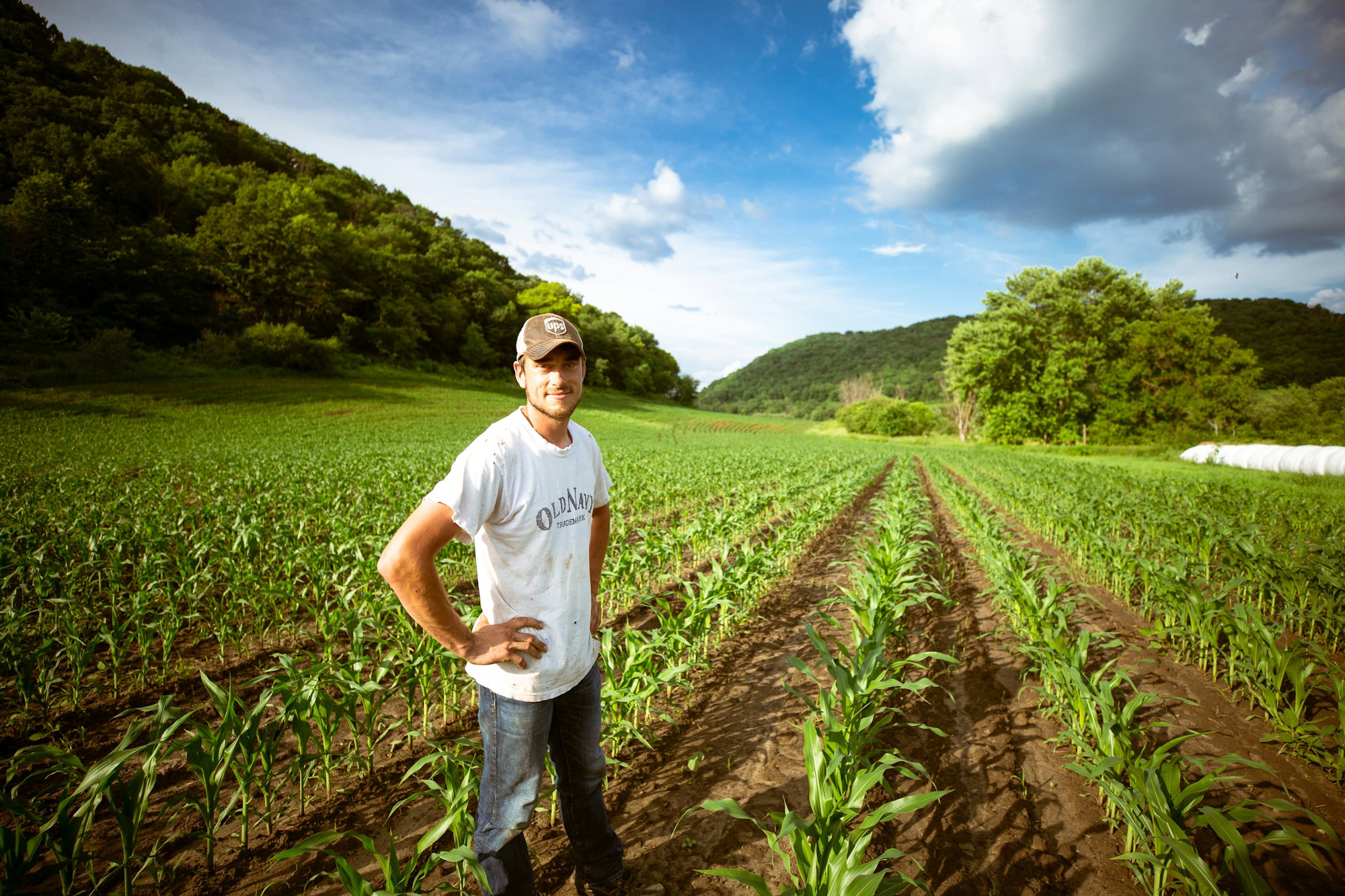 man-standing-on-garden-during-daytime.jpg man standing on garden during daytime